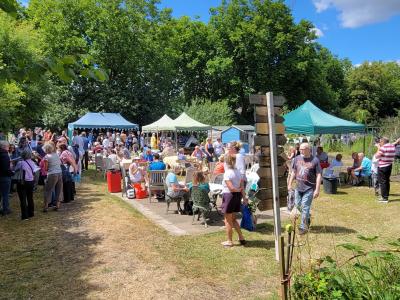 A busy scene around the cake stall & bbq at the 2022 EDAS open day