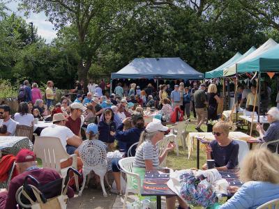 Lots of visitors enjoying refreshments at last year's Northfields Allotments' Summer Open Day