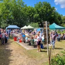 A busy scene around the cake stall & bbq at the 2022 EDAS open day