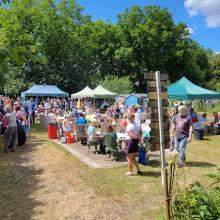 A busy scene around the cake stall & bbq at the 2022 EDAS open day